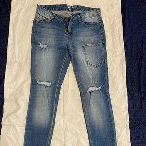 Ripped blue jeans UNUSED